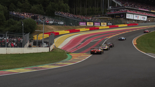 Cars racing up the Eau Rouge, uphill